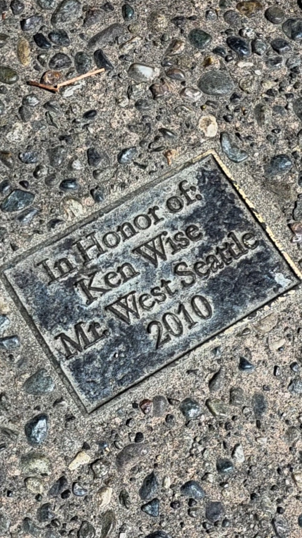 Plaque set in concrete at Rotary Viewpoint Park honoring Ken Wise, Mr. West Seattle, 2010