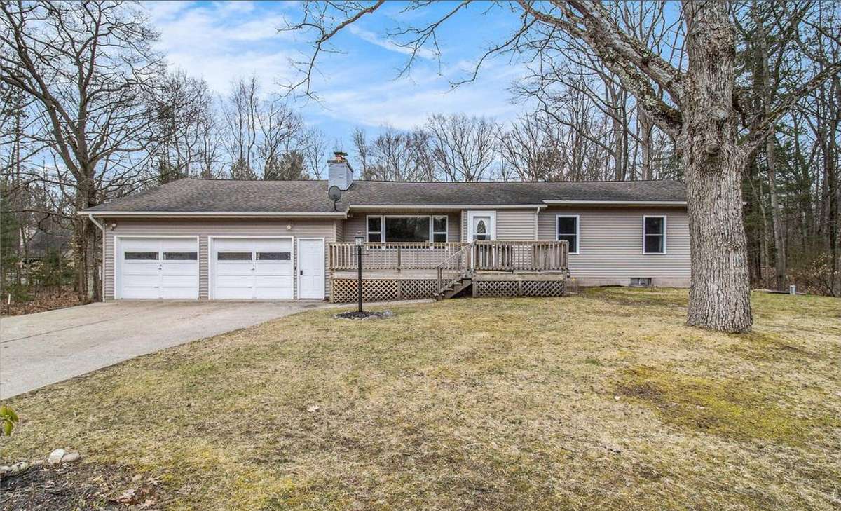Reverse mortgage in Ludington, MI: a typical single-level home, about 1500 sq ft, built around 1957