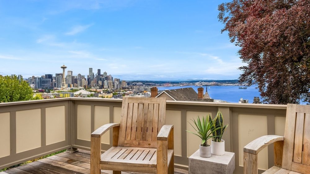 Reverse mortgage in Seattle: a home deck overlooking the Seattle skyline, Space Needle, and Puget Sound