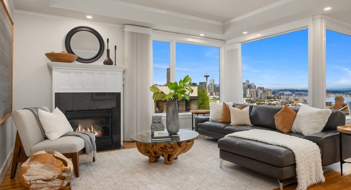 Reverse mortgage in Seattle: a living room with large windows framing the Seattle skyline