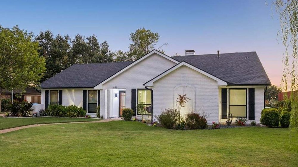Reverse mortgages in Texas: a white-brick ranch home at dusk